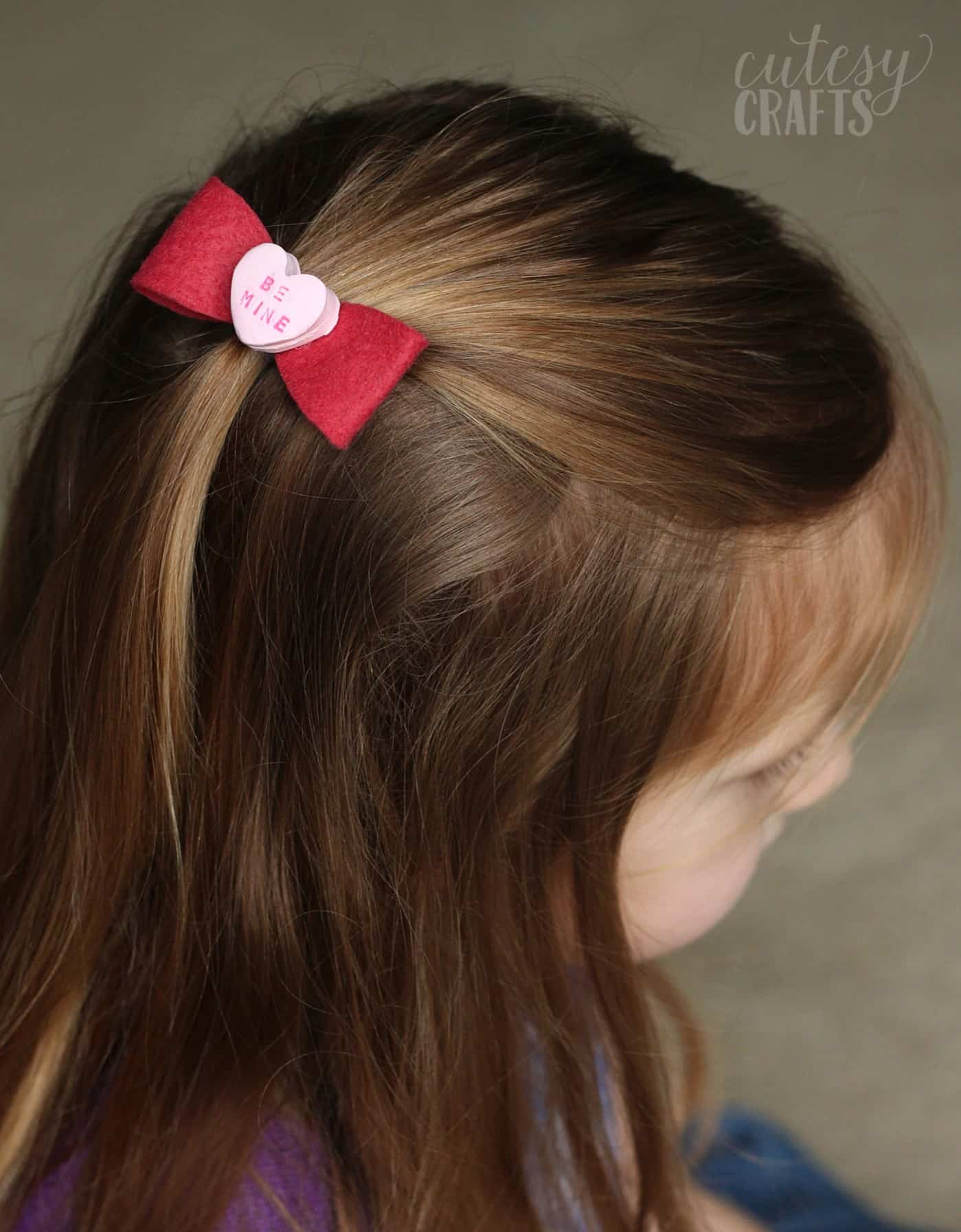 DIY heart clip in a young girl's hair