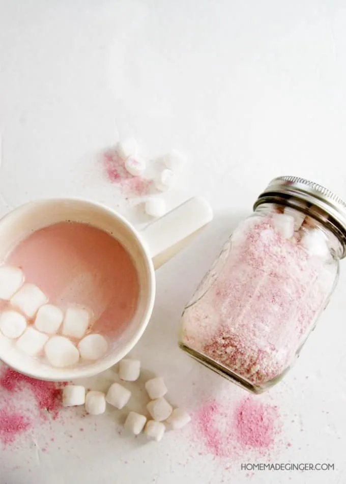 This pink hot chocolate mix has a slightly strawberry flavor that is so delicious - and it couldn't be easier to make! Great for gifts in mason jars.