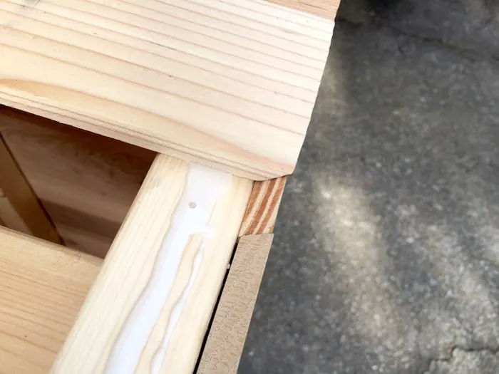 Showing the glue on a portion of the coffee table as well as how the wood comes together