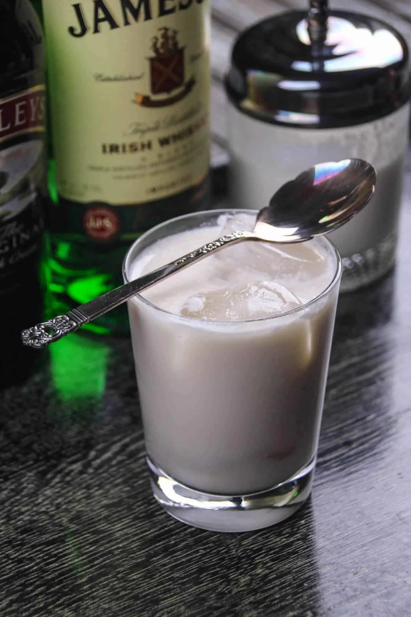 Irish White Russian cocktail with a spoon set on top of the glass