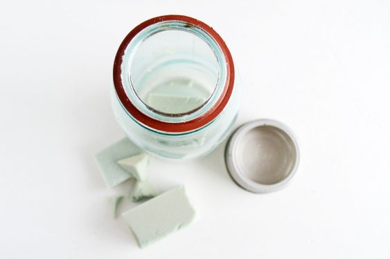 the top of a vintage mason jar with floral foam