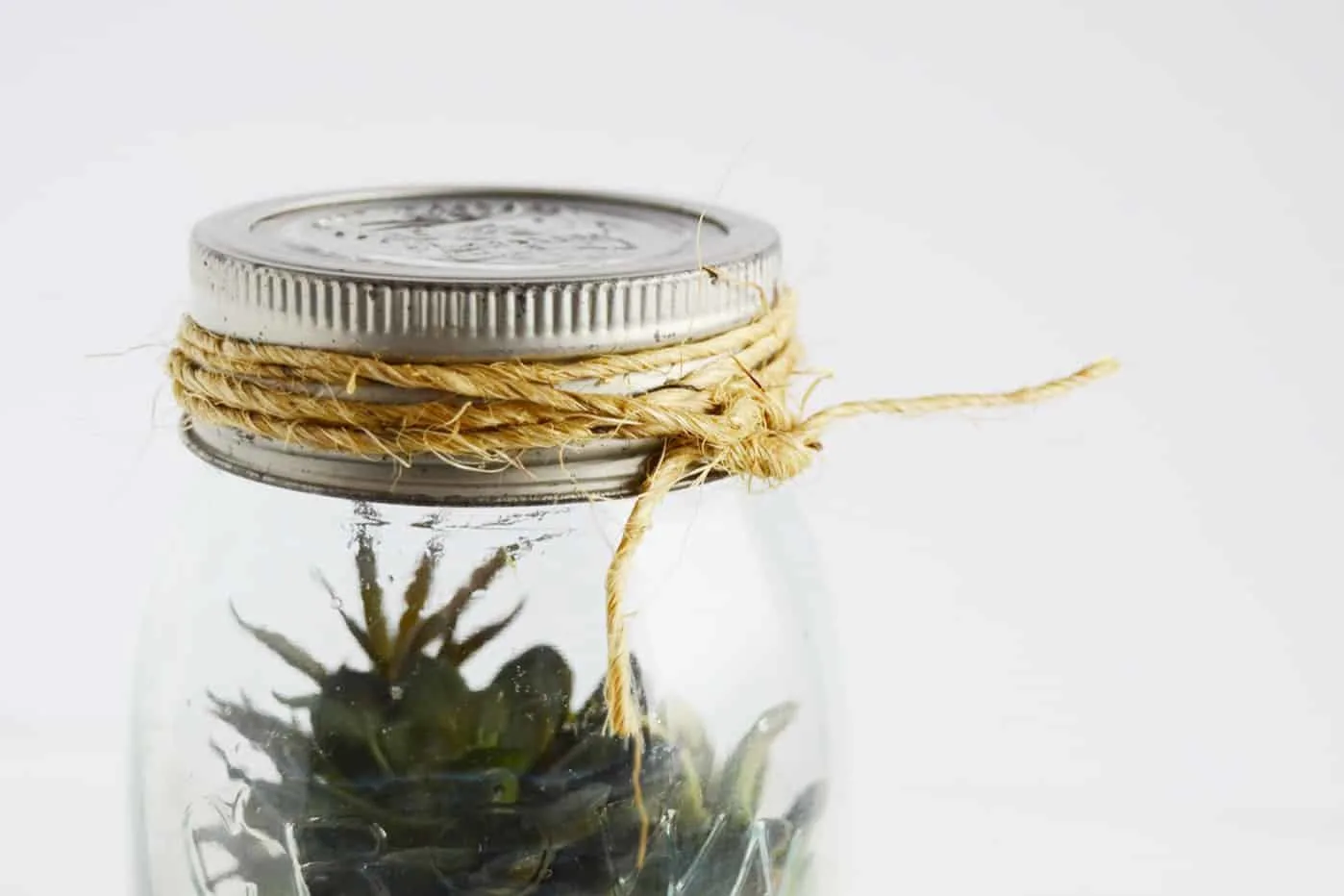 Twine tied around a mason jar lid