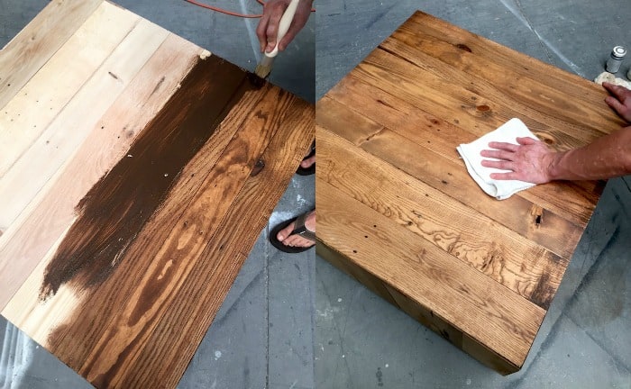 Applying stain to the coffee table and wiping away with a rag