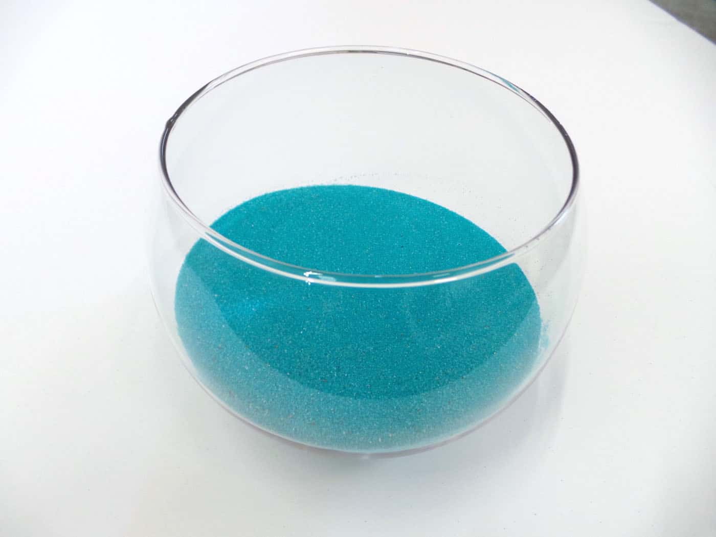 Craft sand in a clear glass bubble bowl