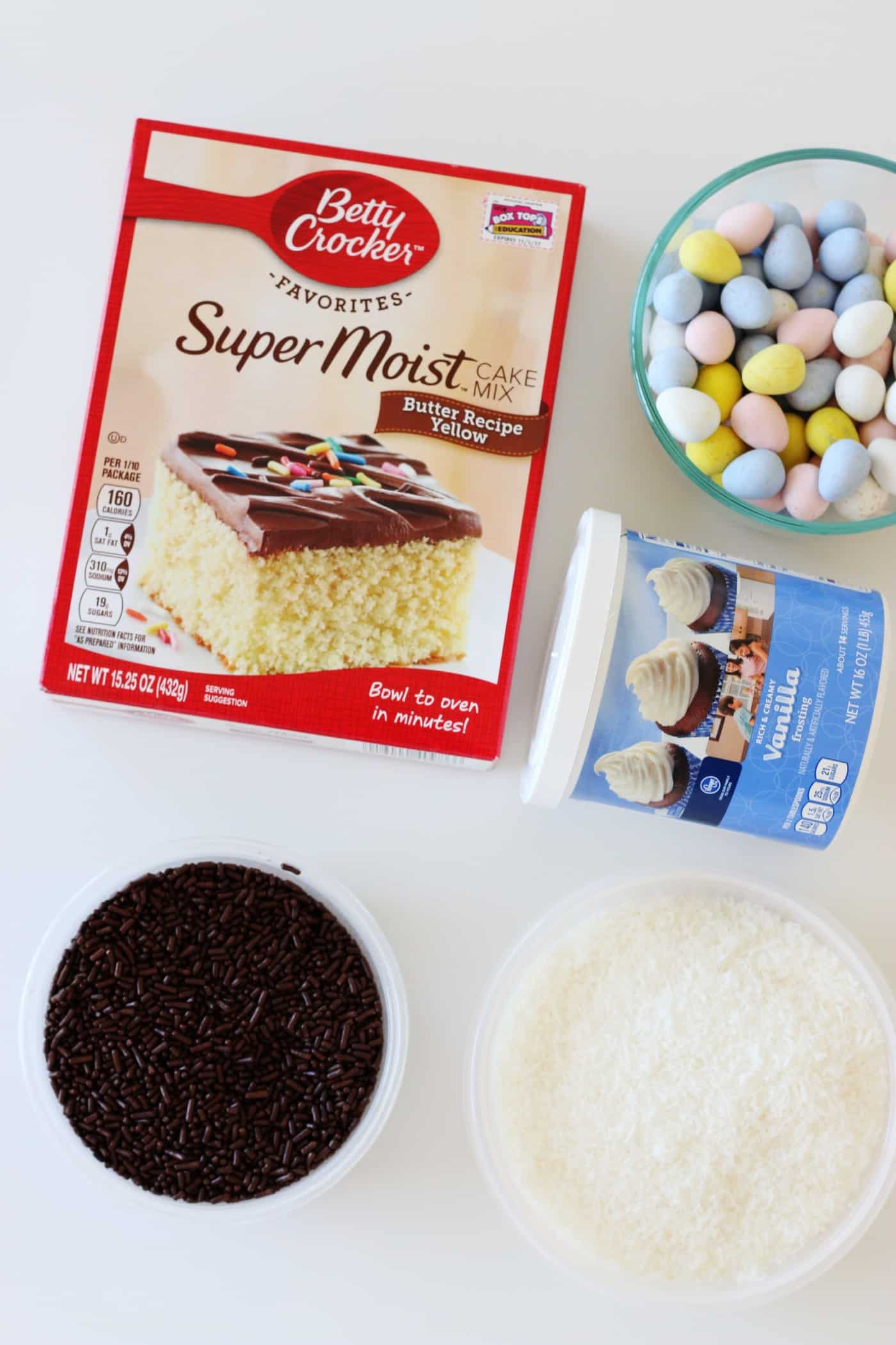 Cake mix, vanilla icing, Cadbury eggs, chocolate sprinkles