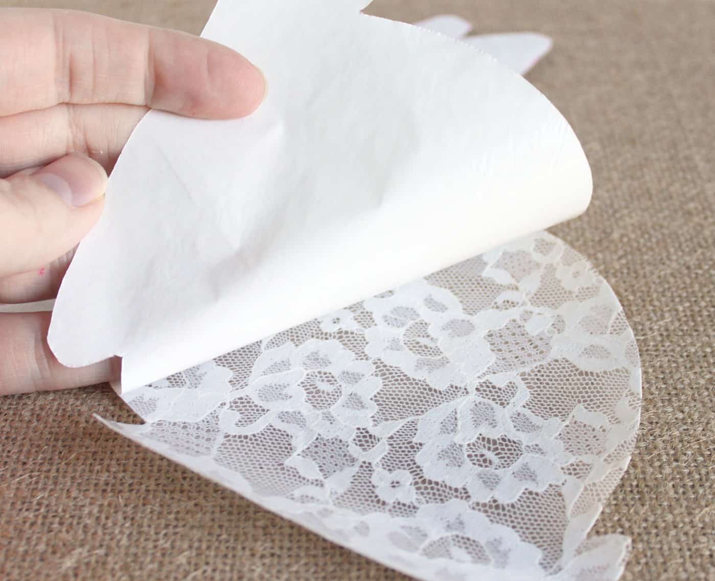 Peeling the Heat n' Bond off of the lace rabbit shape