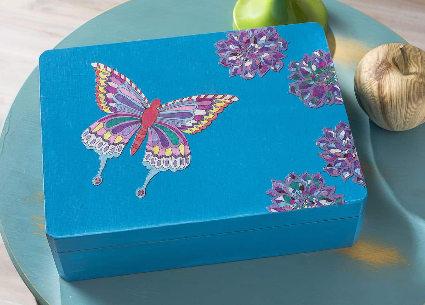 Learn how to decorate a box with paint, coloring pages, and Mod Podge