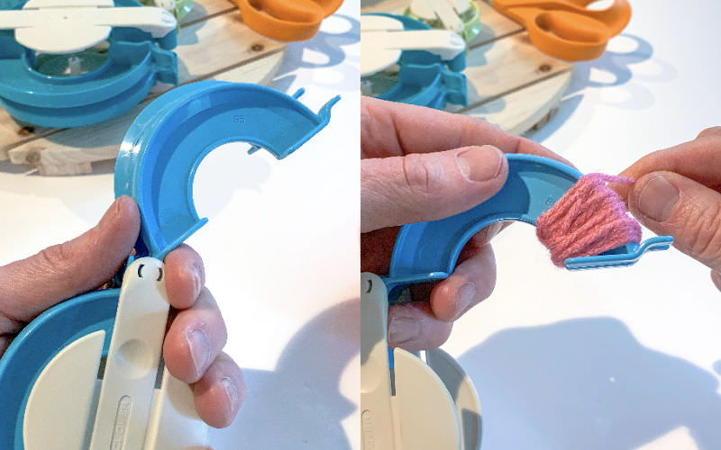 Wrapping yarn around the arches in a pom pom maker