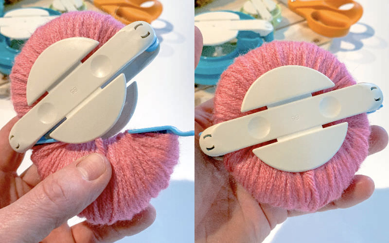 Yarn wrapped around the arches in a pom pom maker