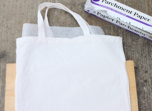 Place a piece of parchment paper between two layers of a tote