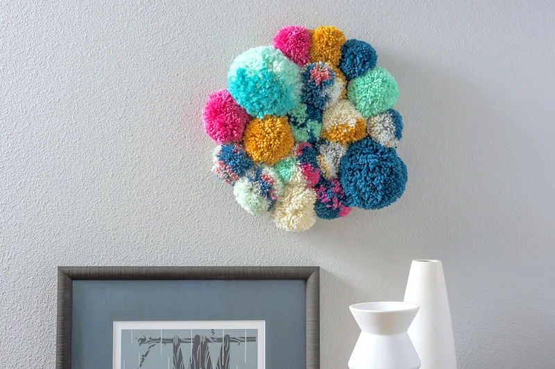 Photo inspiration: Pom Pom Wall Hanging Super Easy DIY Photo Inspiration