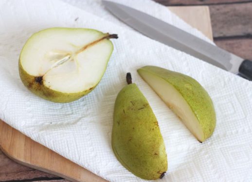cutting a pear in half and then quarters