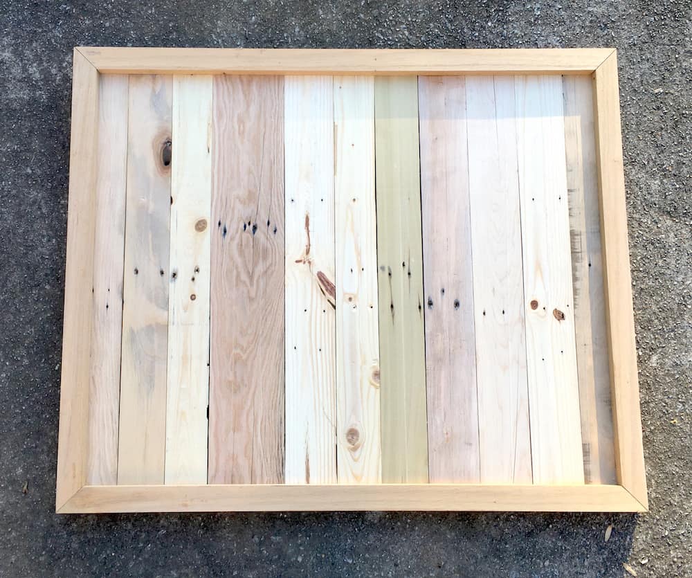 Pallet wood background in a wood frame assembled