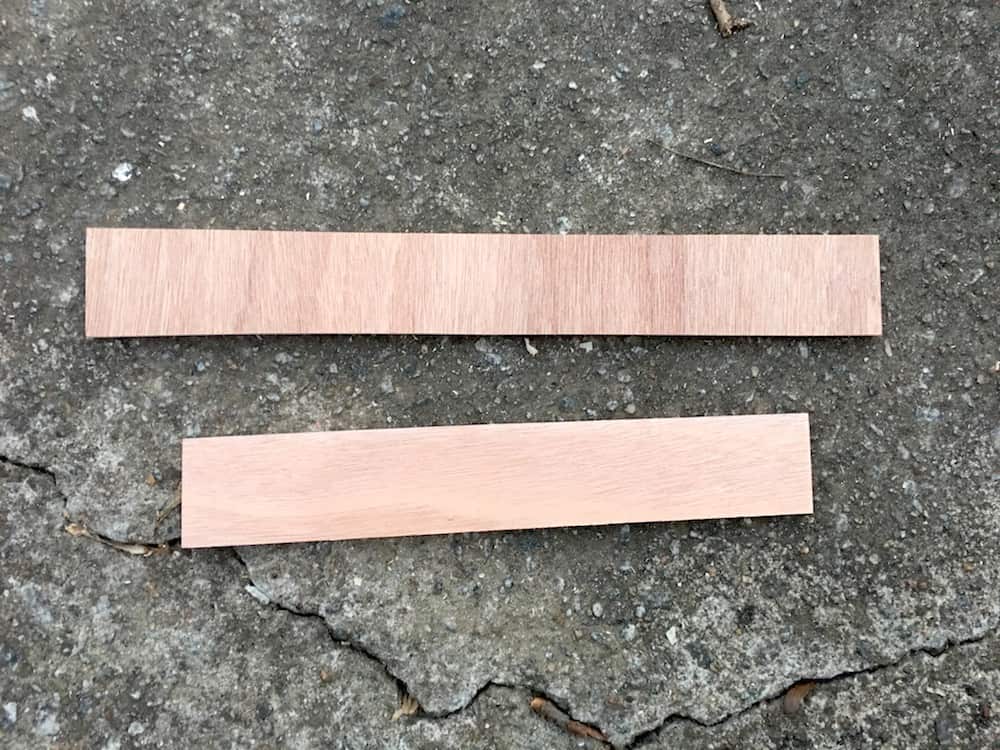 Two wood scraps laying on the ground