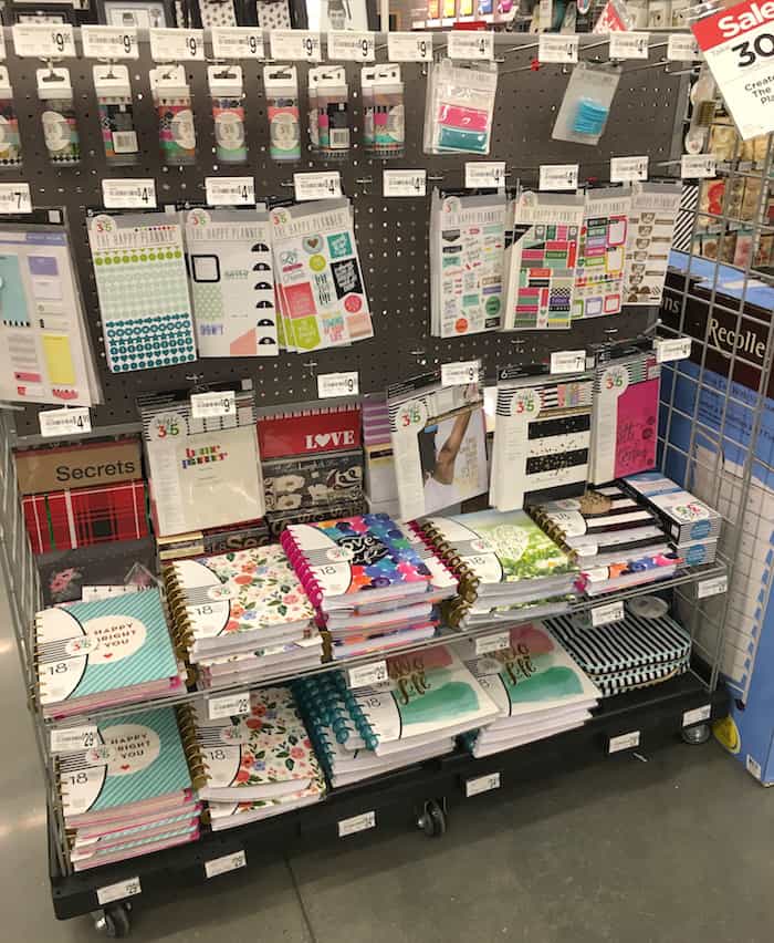Happy planners and inserts on a rack at Michaels