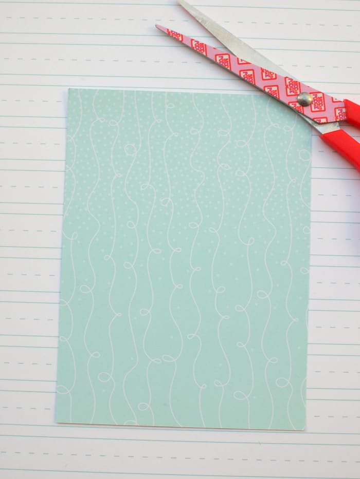 Piece of cardstock cut into a rectangle with scissors