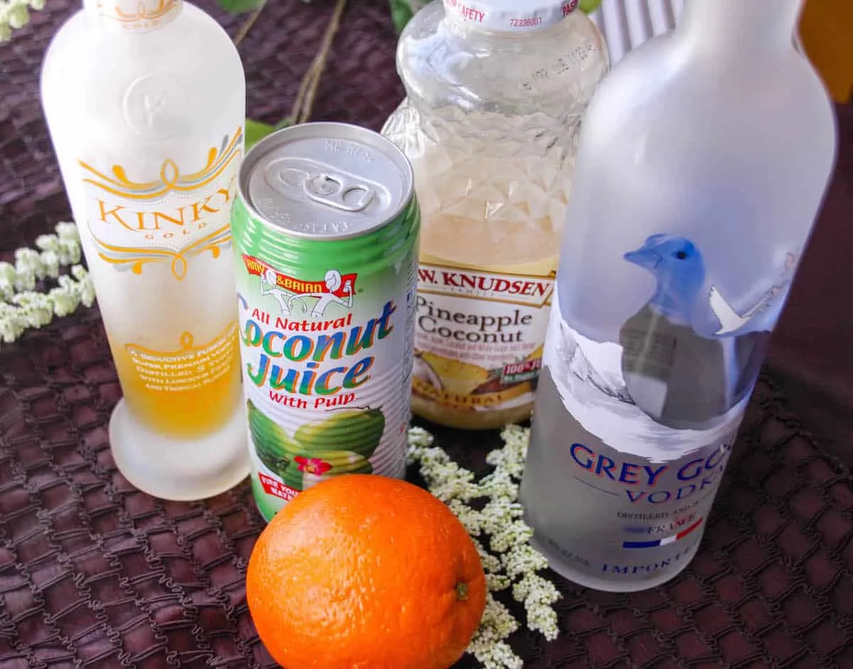 Kinky Gold, RW Knudsen pineapple coconut juice, coconut juice, Grey Goose Vodka, and an orange
