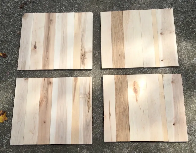 Four panels of cut pallet wood laying on the ground