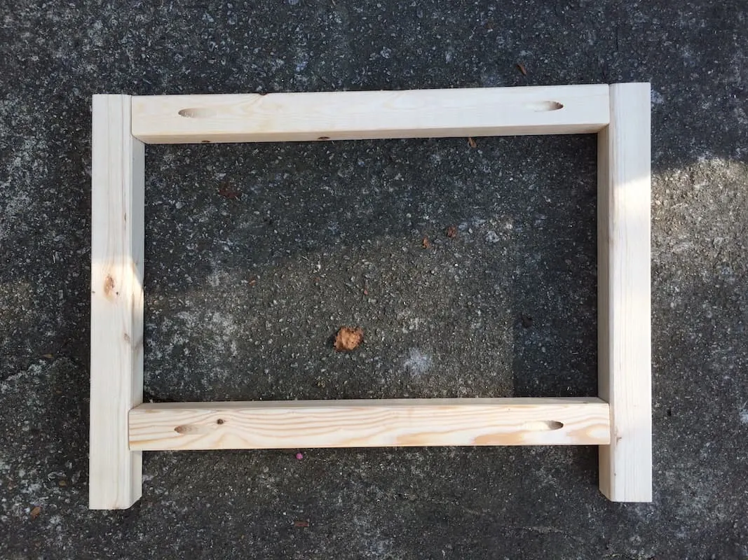 Assembled wood frame laying on the ground