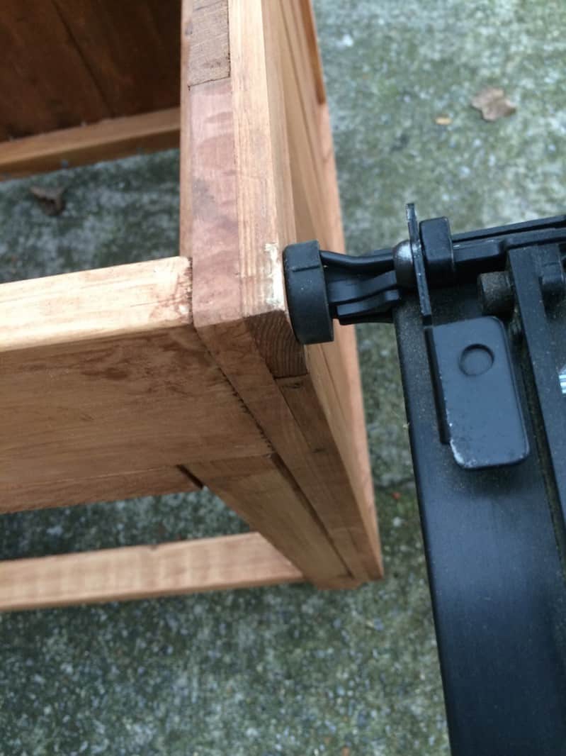 Nail gun the sides of the hose caddy to secure