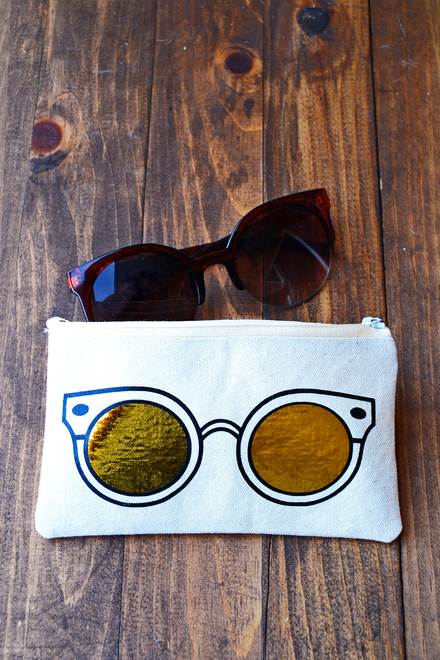 Learn how to make a unique DIY sunglasses case using heat transfer vinyl and a die cutter. This trendy project includes a free template!
