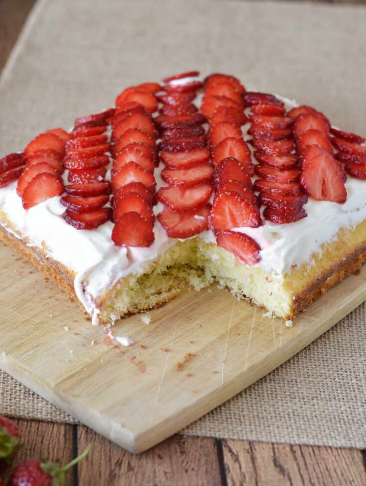 This strawberry cake recipe is a showstopper! It's moist and delicious - and not too sweet. Make this pretty, tasty dessert quickly and easily.