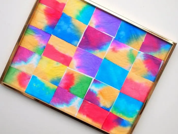 Food coloring art in a frame made with paper towels