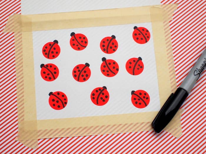 Red circle stickers applied to the front of the card and turned into ladybugs with dots using a Sharpie
