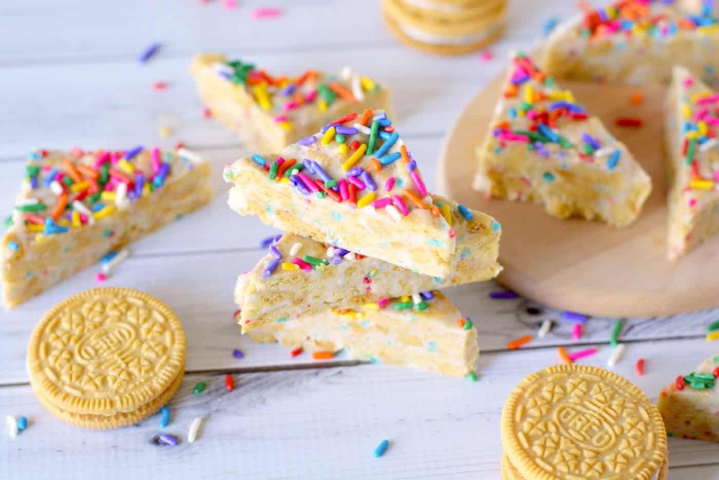 This Oreo dessert features delicious cereal bits that taste just like Fruity Pebbles! Easy to make because it's no bake - your kids will love these.