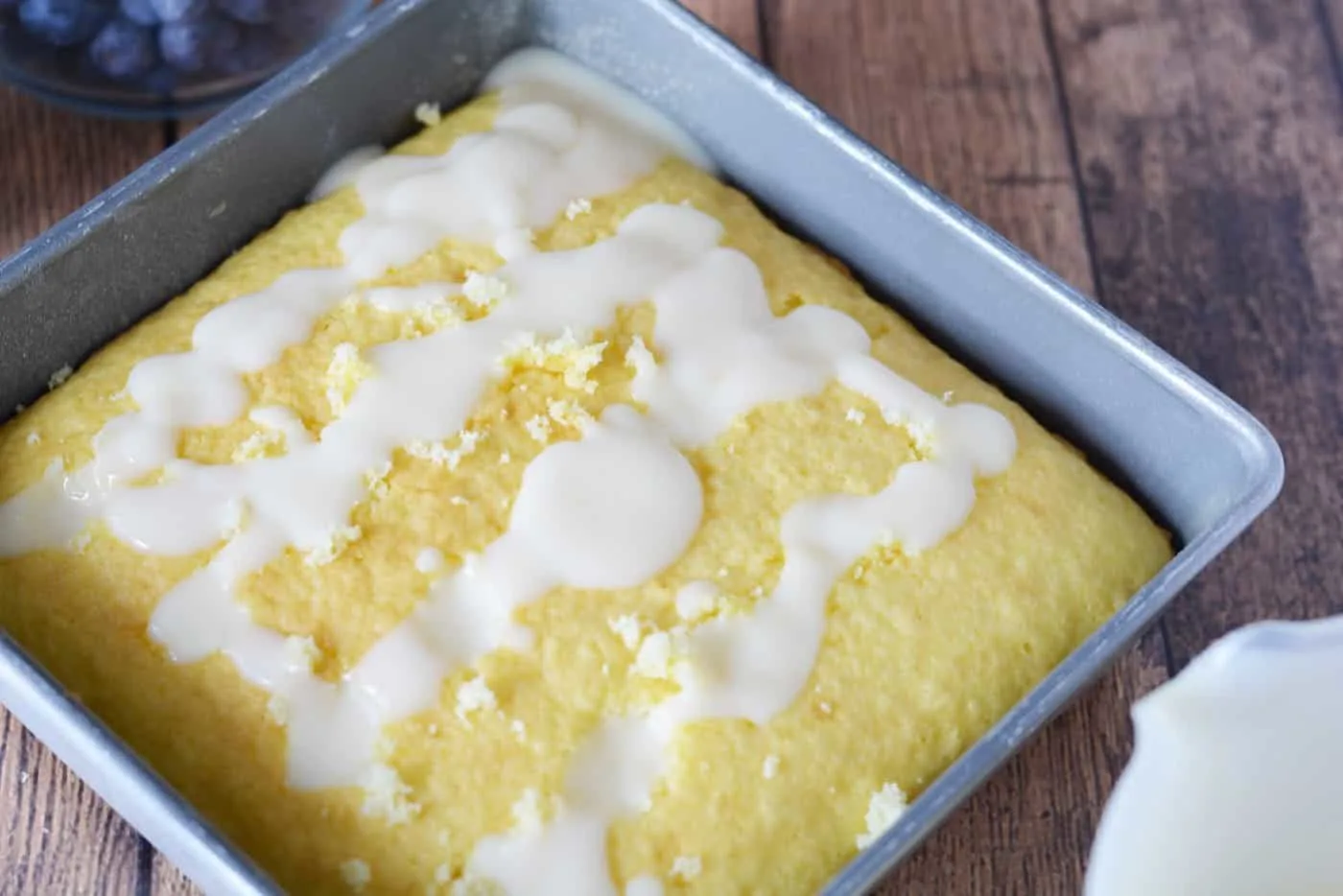 Adding pudding to the top of the cake