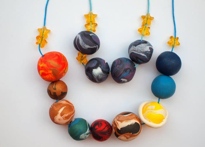 Are you looking for a kids jewelry project that’s out-of-this-world fun? This strand of planets is made with clay - it's really easy to do!