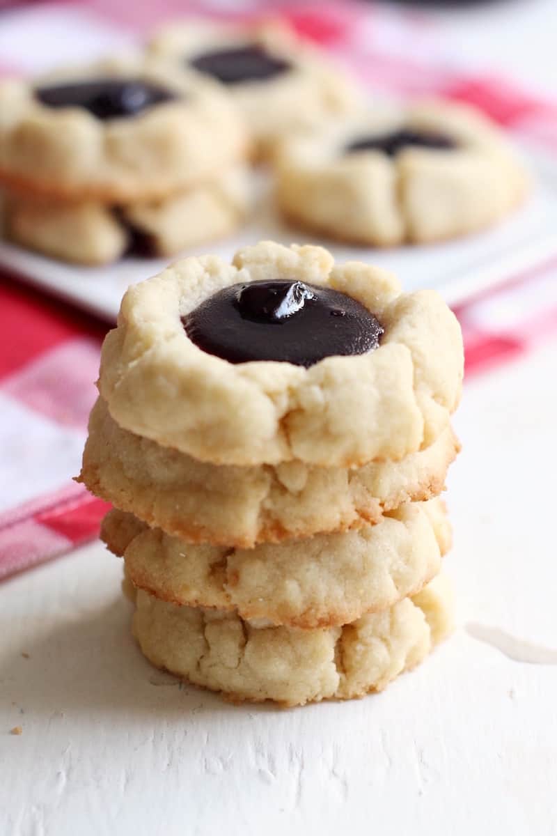 These are the most delectable thumbprint cookies filled with a perfect pool of decadent blueberry lemon homemade jam. They are so moist and light!