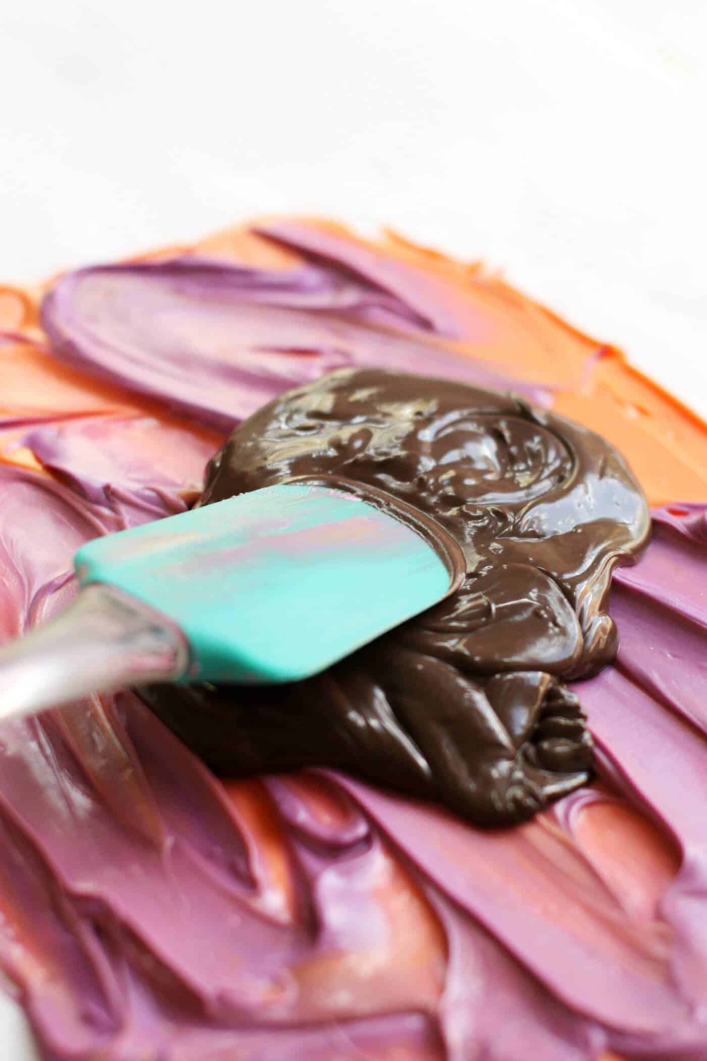 Halloween candy melts smoothing with a spatula