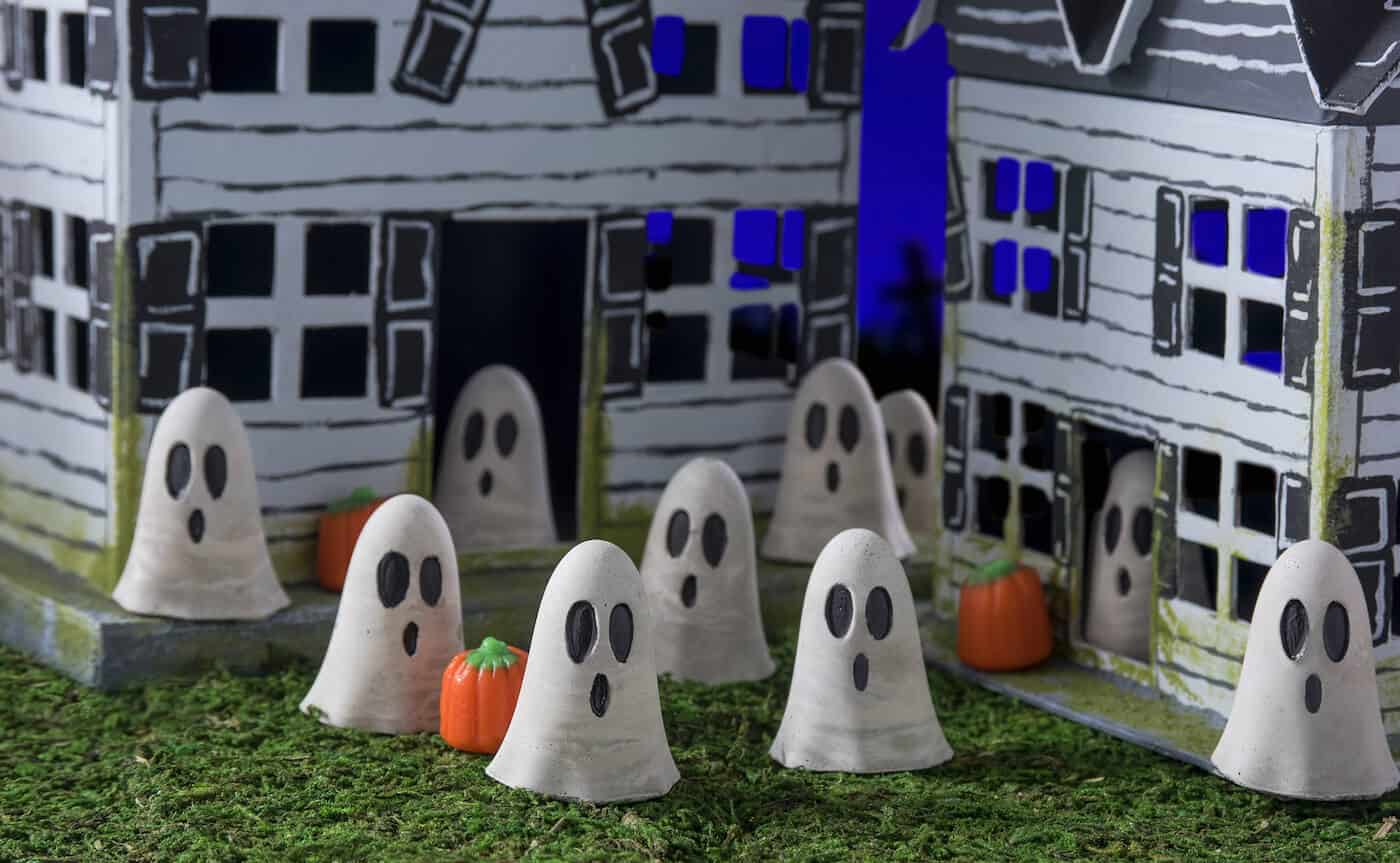 Use Quikcrete, paper mache houses, acrylic paint, and a few other supplies to create a spooky village for Halloween! Kids will love to participate too.