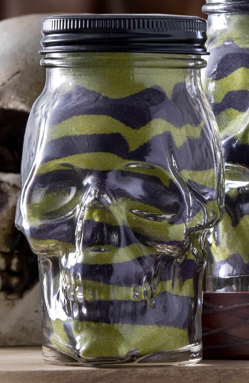 Do you remember sand art from when you were young? Revisit it in this fun Halloween project using skull mason jars! Perfect for holiday decor.