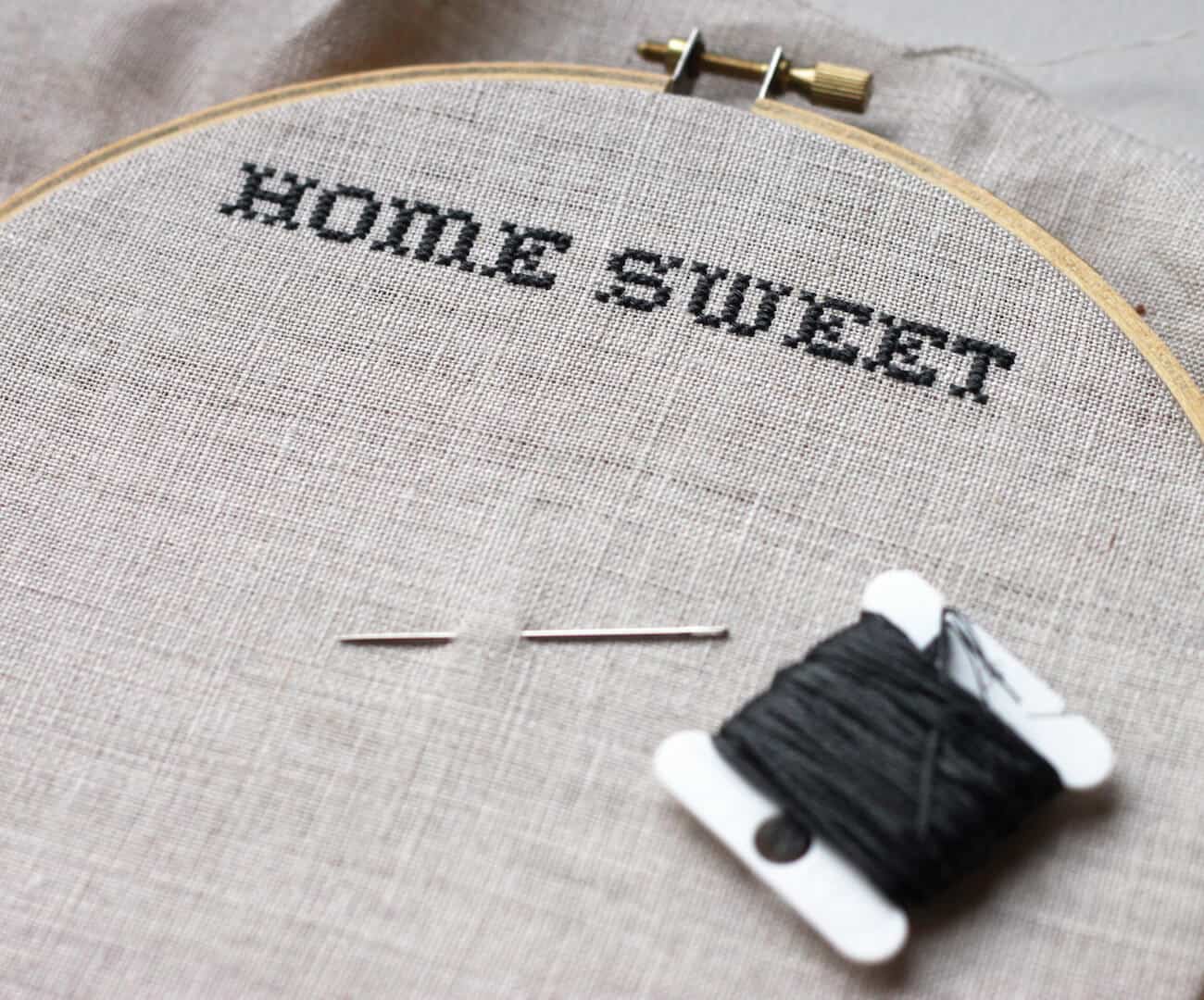 "Home Sweet" embroidered in black thread