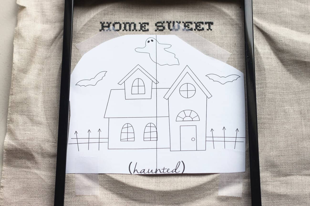 Haunted house pattern on top of linen