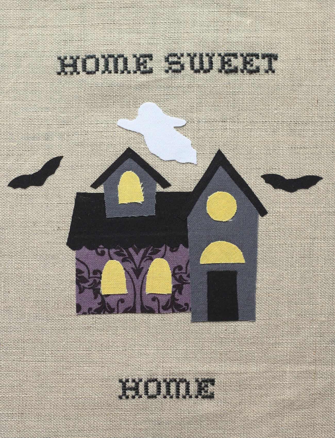 Learn to make this cute "Home Sweet (Haunted) Home" Halloween embroidery wall hanging - and use up your fabric scraps. Get a free pattern too!