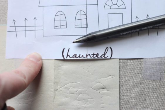 Transferring the pattern onto the linen with carbon paper