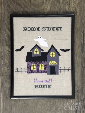 haunted mansion embroidery in a frame