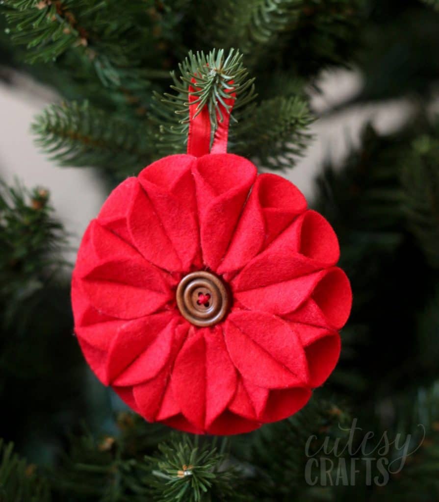 This felt Christmas ornament inspired by poinsettias was a lot of fun to make, and it was really easy too! No sewing required.