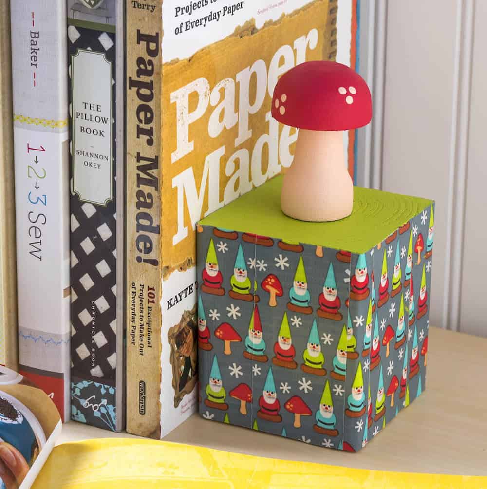 Learn to make these DIY bookends using supplies found at the craft store! Isn't the gnome and mushroom theme so cute? Perfect for kids' rooms.