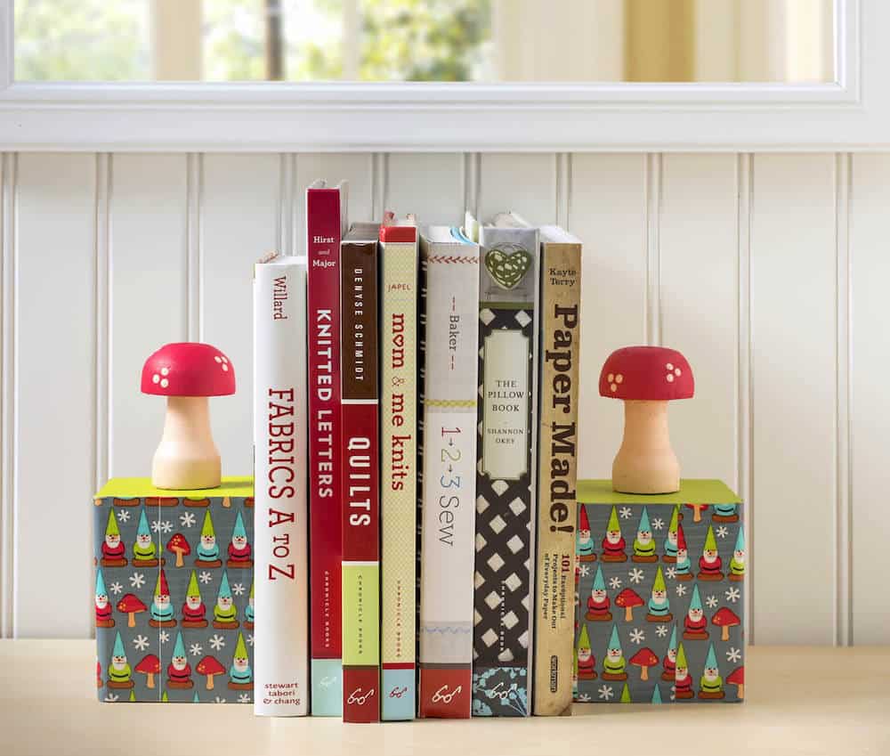 Learn to make these DIY bookends using supplies found at the craft store! Isn't the gnome and mushroom theme so cute? Perfect for kids' rooms.