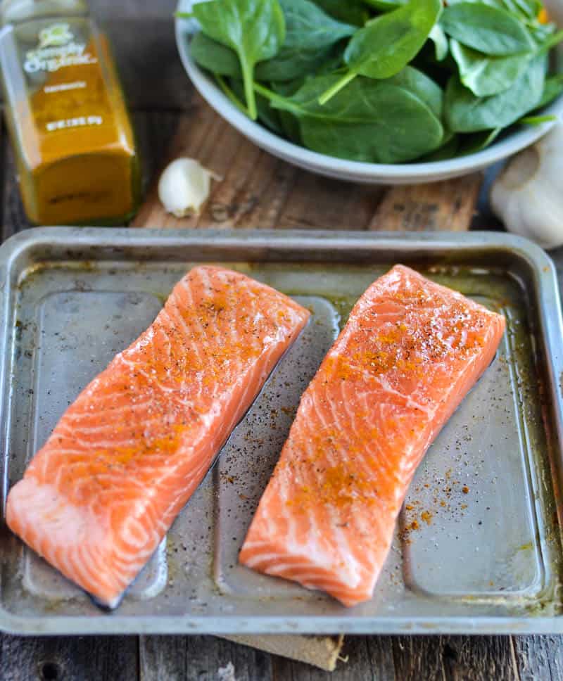 If you're looking for delicious and easy adrenal fatigue recipes, this baked salmon with garlic spinach is perfect - and so simple to make!