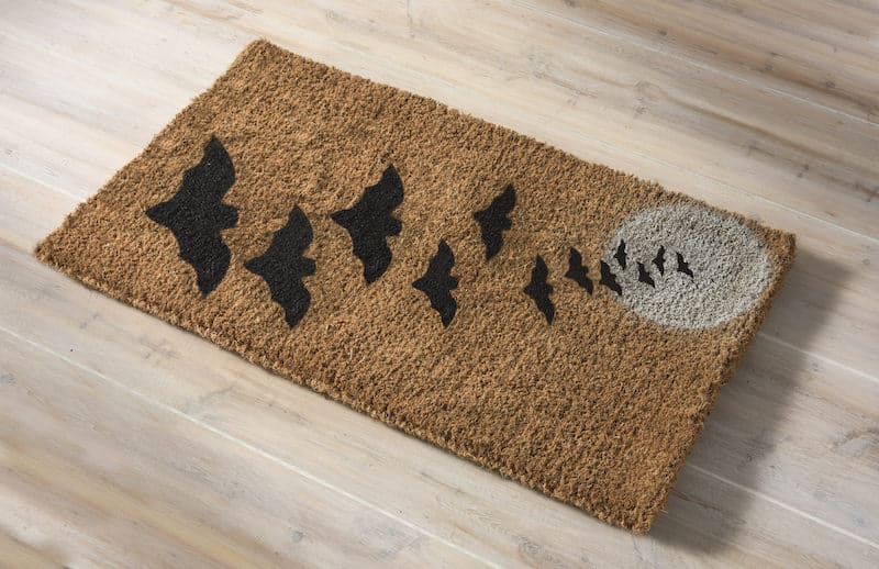 Welcome mats are so fun for the holidays! Make a simple and fun DIY Halloween doormat for your home with spray paint. Templates provided.