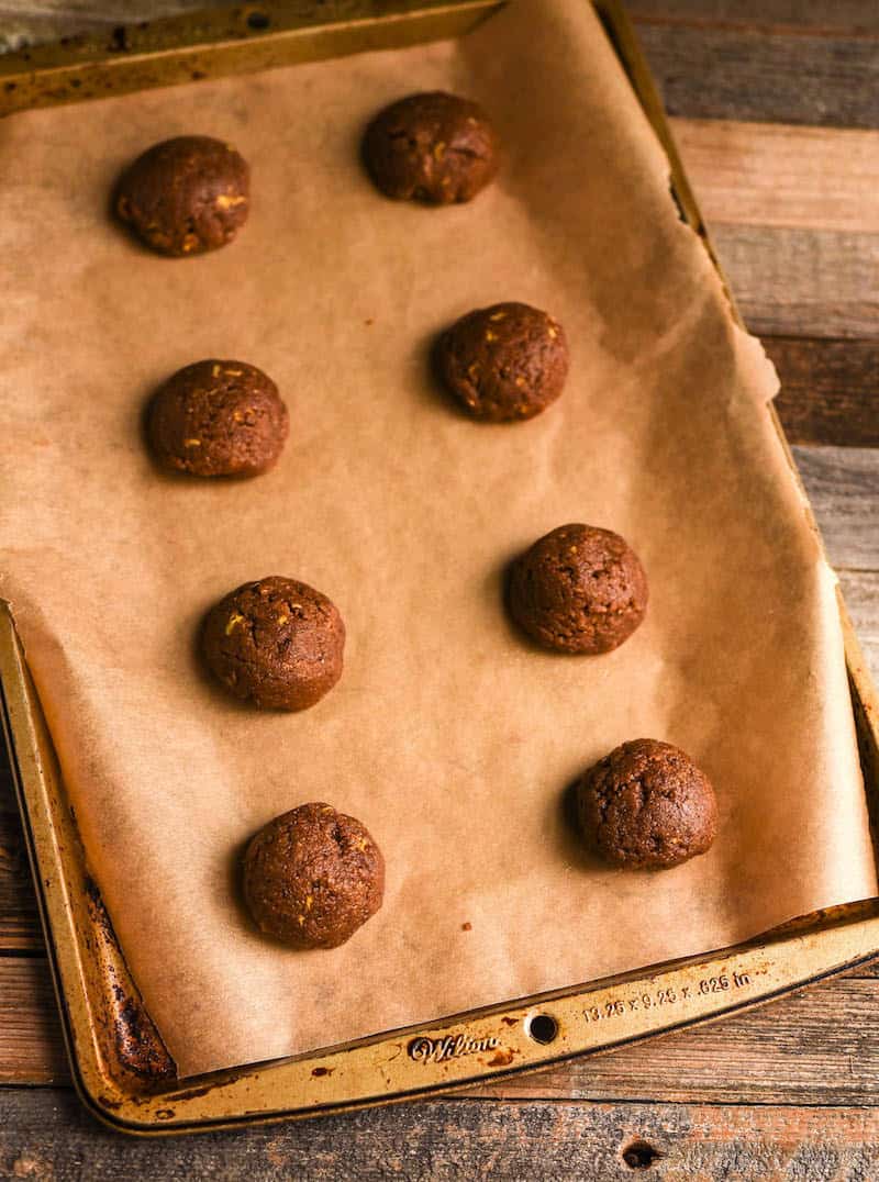 Cookie dough on parchment paper on a cookie sheet