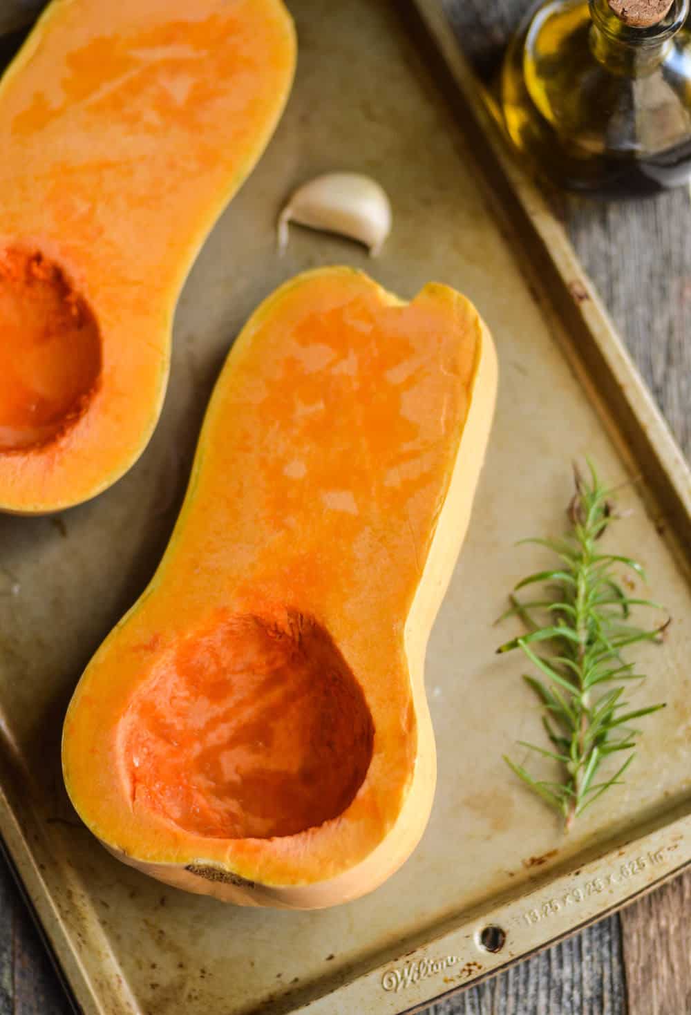 The garlic and rosemary make this roasted butternut squash recipe! Perfect for a weeknight dinner or even a side for a holiday.