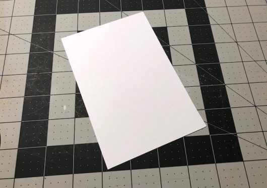 White paper cut to fit the frame