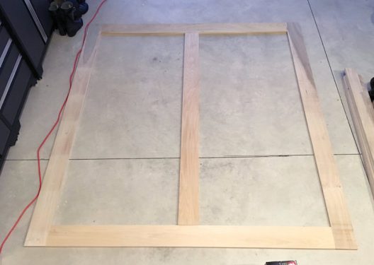 Poplar wood laid out on a garage floor