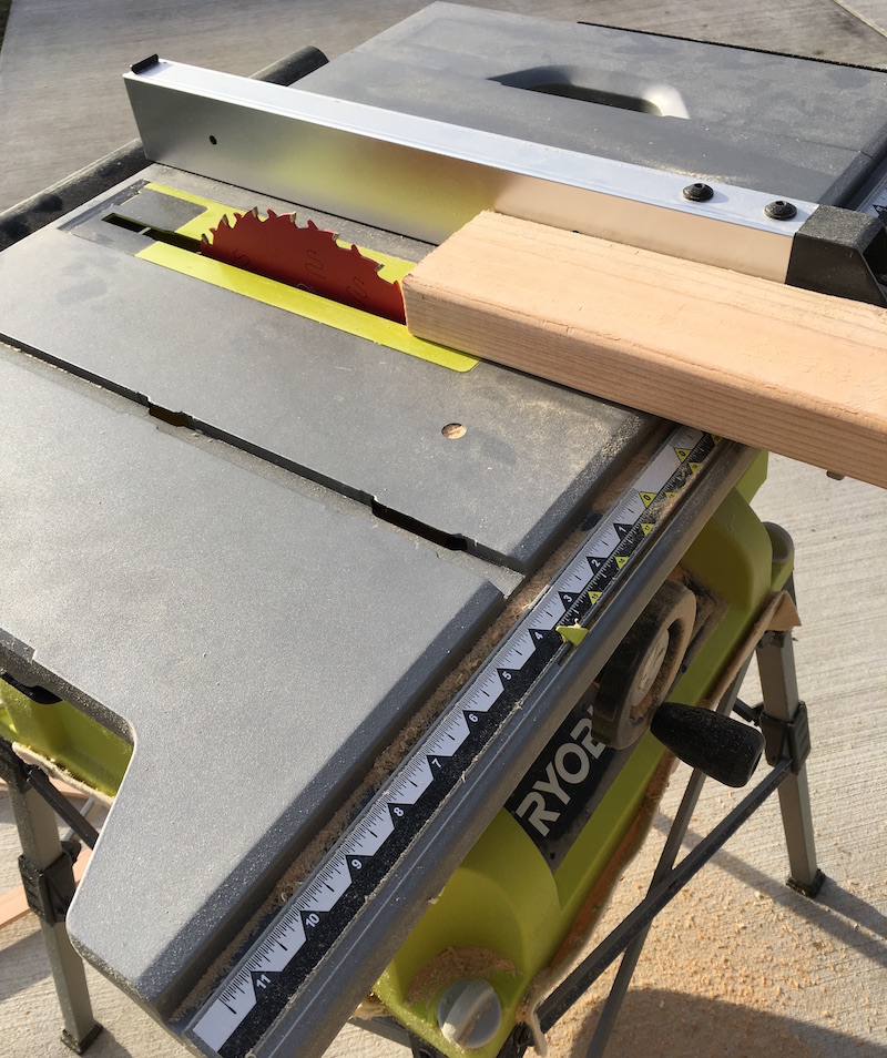 Using a Ryobi table saw to trim the long side of the wood pieces
